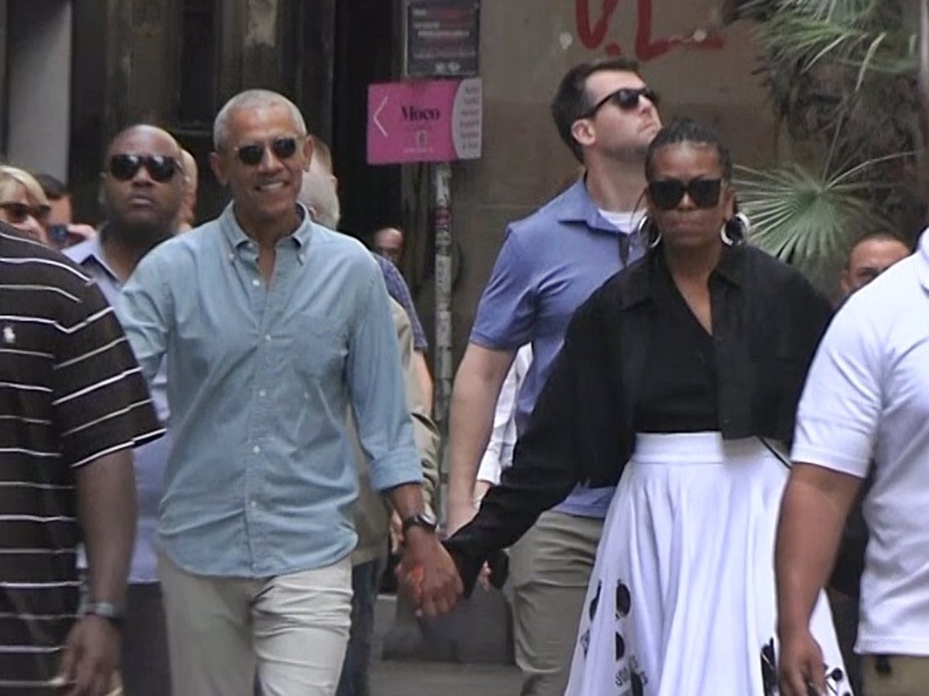 The Obamas display their love on a stroll through Barcelona